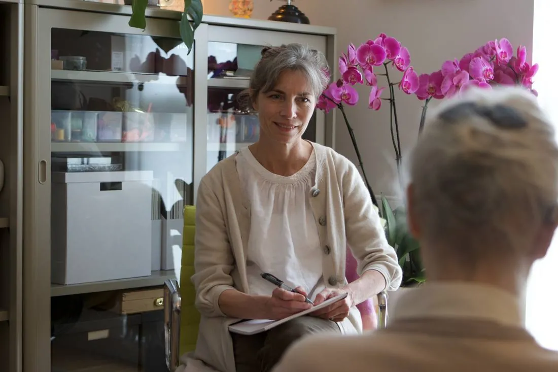 Corinna in session with a client