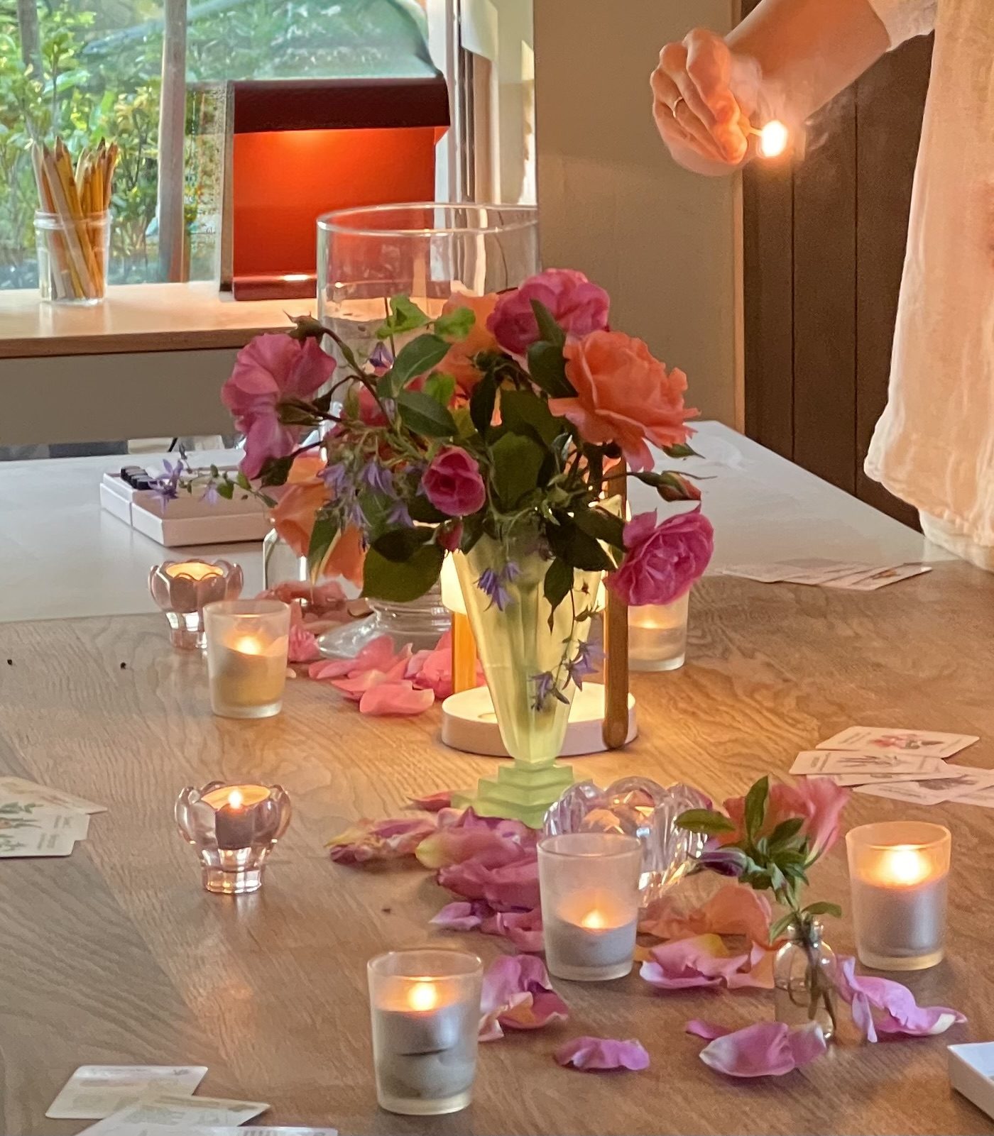 Lighting a tealight at the afternoon table