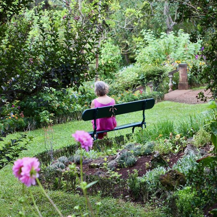 Corinna on a bench in the garden