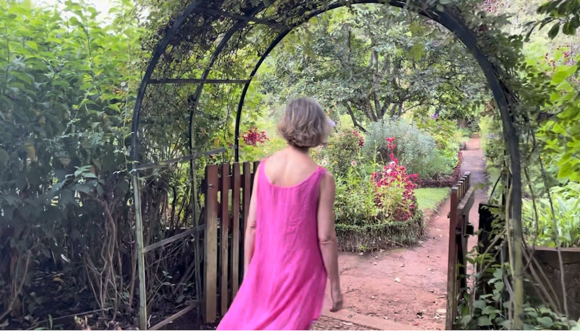 A garden archway opening onto a path